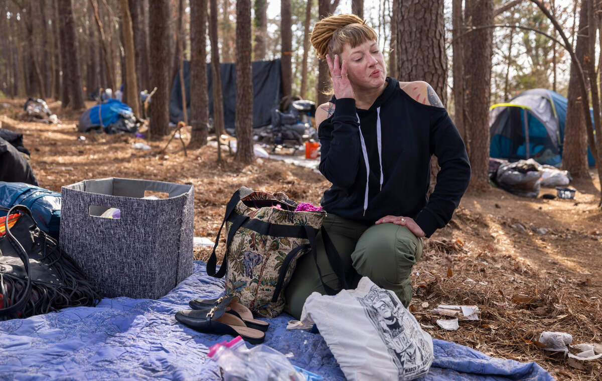 Nicole Reynolds packs up her personal belongings on Friday, January 31, 2025 in an encampment along Goode Street in Raleigh, N.C.  Reynolds is among a group of people who have been living on a strip of land between Goode Street and the State Farmers Market.  The land was recently posted asking for the property to be vacated by January 31, 2025.