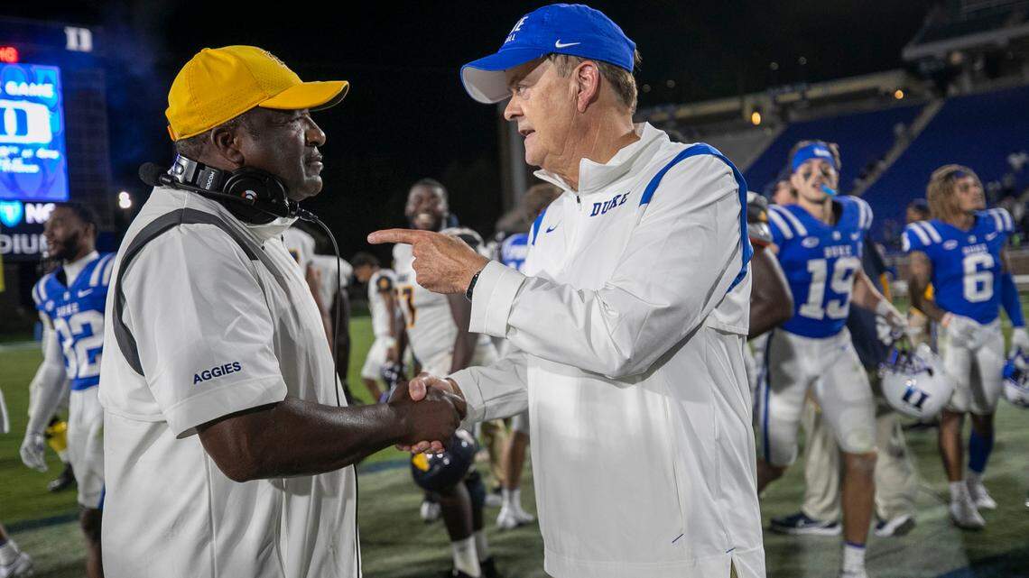 North Carolina A&T head coach Sam Washington congratulates Duke coach David Cutcliffe following the Blue Devils’ 45-17 victory on Friday, September 10, 2021 at Wallace Wade Stadium in Durham, N.C.