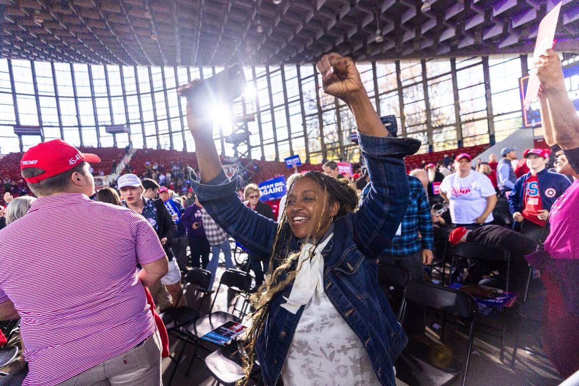 A supporter cheers as Republican presidential nominee and former President Donald Trump leaves the stage following a rally at Dorton Arena in Raleigh on Monday, Nov. 4, 2024, one day before Election Day.