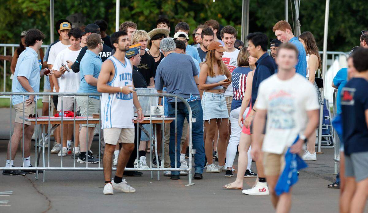 Attendees arrive at “Flagstock 2024,” an invite-only concert event featuring country musicians Big & Rich and Lee Greenwood, among others, at a location in Chapel Hill, N.C., Monday, Sept. 2, 2024. Flagstock started after a GoFundMe raised over $500,000 for a “rager” for UNC-Chapel Hill fraternity brothers who held up the American flag during an April campus protest.