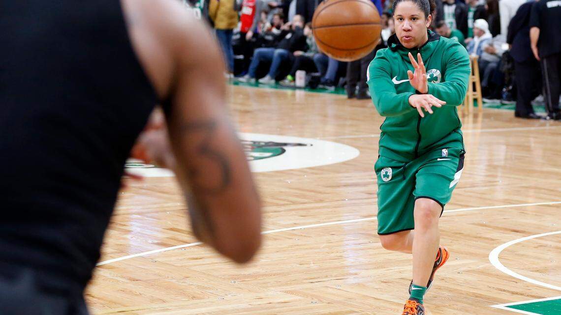 Boston Celtics assistant coach Kara Lawson works with Marcus Smart, left, during warmups before an NBA basketball game against the Philadelphia 76ers in Boston, Saturday, Feb. 1, 2020. (AP Photo/Michael Dwyer)