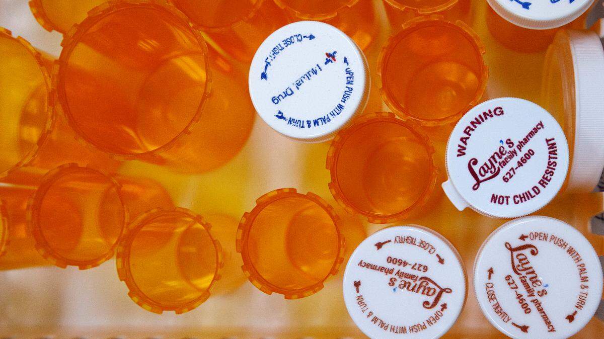Empty vials sit in a tray behind the counter at Layne’s Family Pharmacy on Wednesday, Aug. 14, 2024, in Eden, N.C.