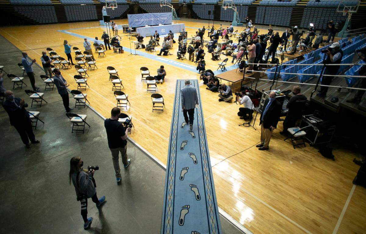 Roy Williams walks into the Dean Smith Center in Chapel Hill, N.C., on April 1, 2021, to announce his retirement. 