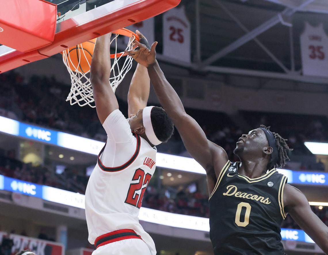 N.C. State’s Ven-Allen Lubin gets past Wake Forest’s Omaha Biliew for a dunk during the second half of the Wolfpack’s 70-57 win on Wednesday, Dec. 31, 2025, at Lenovo Center in Raleigh, N.C.