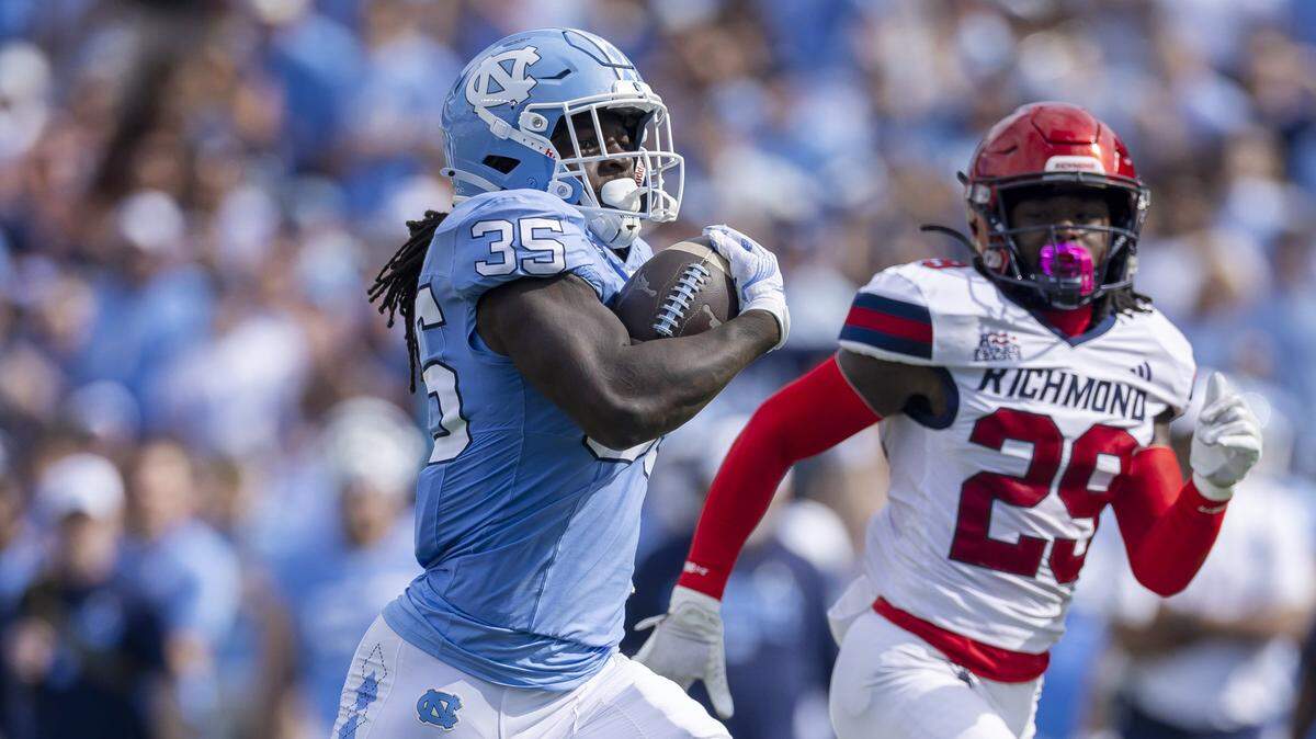 North Carolina running back Demon June (35) breaks open for a 50-yard gain in the first quarter against Richmond on Saturday.