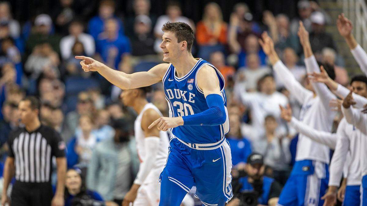 Duke’s Kyle Filipowski (30) reacts after sinking a there point basket to give the Blue Devils a 58-52 lead in the second half against Miami during in the semi-finals of the ACC Tournament on Friday, March 10, 2023 at the Greensboro Coliseum in Greensboro, N.C. Filipowski lead Duke with 17 points in their 85-78 victory.
