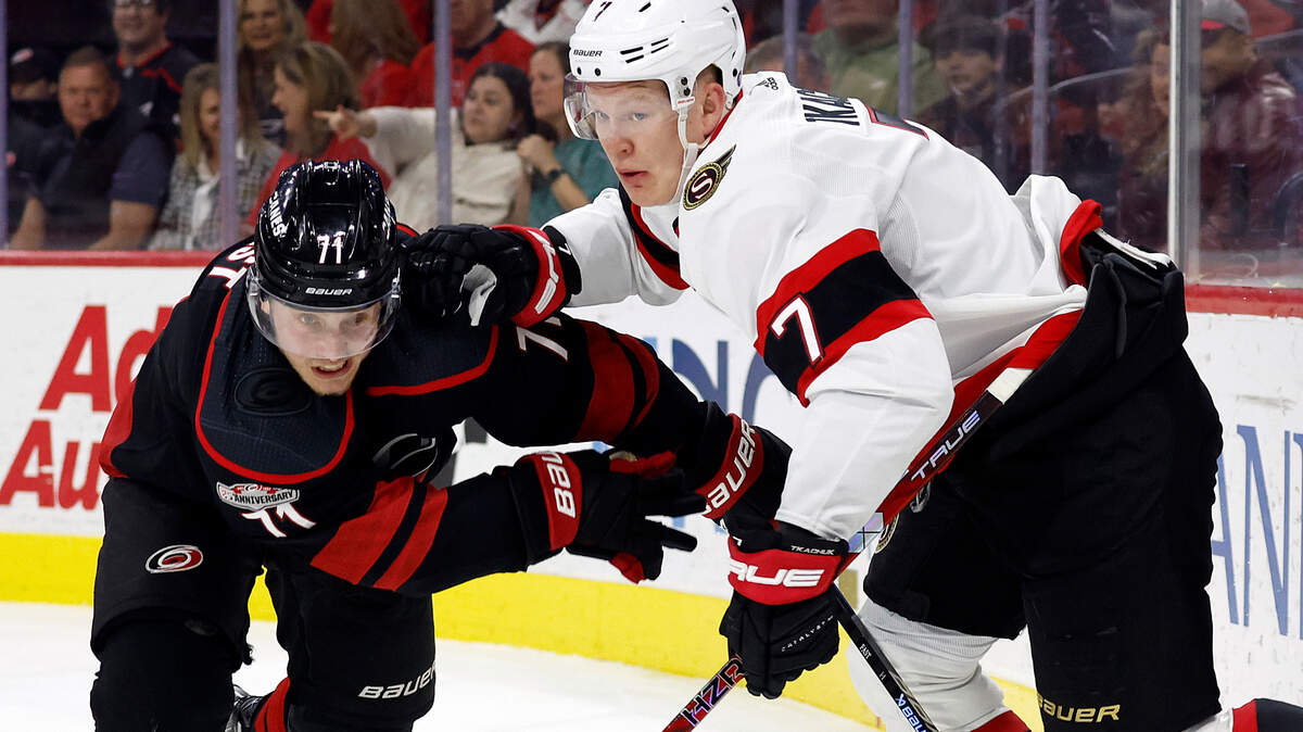 Carolina Hurricanes’ Jesper Fast (71) works against Ottawa Senators’ Brady Tkachuk (7) during the first period of an NHL hockey game in Raleigh, N.C., Friday, Feb. 24, 2023. (AP Photo/Karl B DeBlaker)