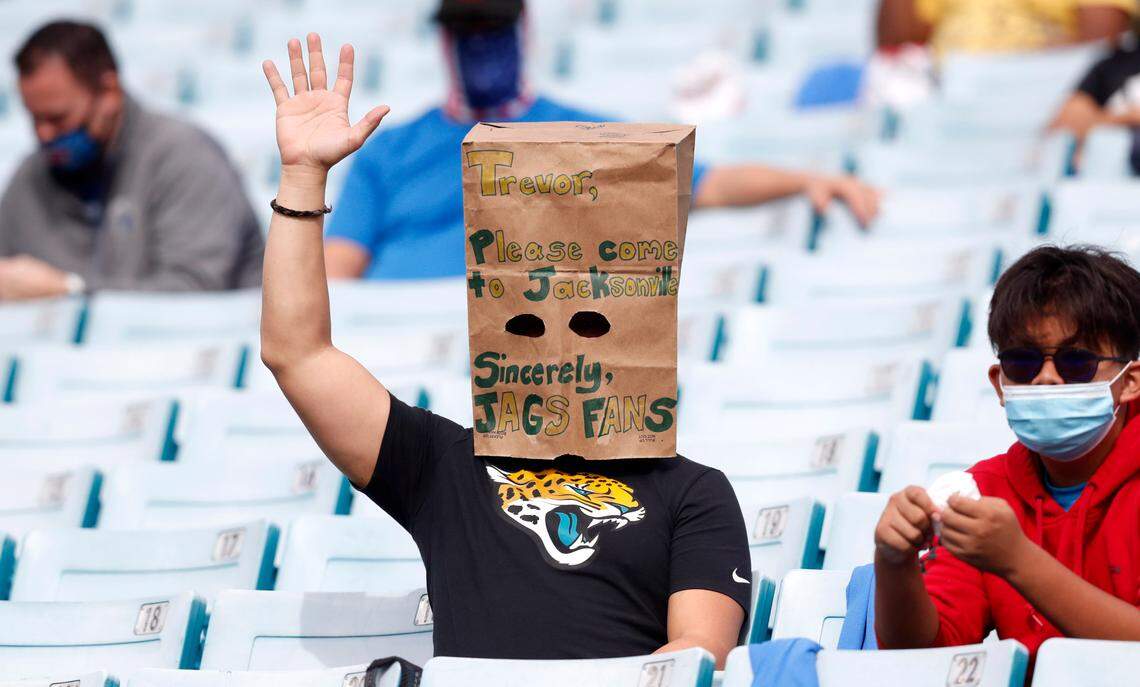 A Jacksonville Jaguars fan makes his plea to Clemson’s Trevor Lawrence during the first half of N.C. State’s game against Kentucky in the Gator Bowl at TIAA Bank Field in Jacksonville, Fla., Saturday, January 2, 2021.