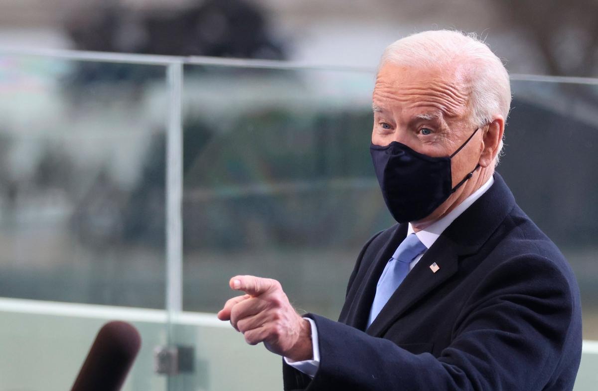 President-elect Joe Biden gestures as he arrives for his inauguration, Wednesday, Jan. 20, 2021, at the U.S. Capitol in Washington.