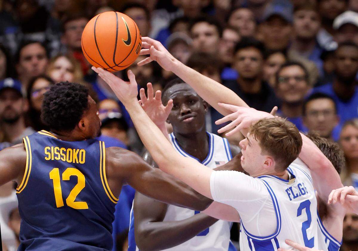 Duke’s Cooper Flagg (2) tries to pull in a rebound from California’s Mady Sissoko (12) during the first half of Duke’s game against Cal at Cameron Indoor Stadium in Durham, N.C., Wednesday, Feb. 12, 2025.