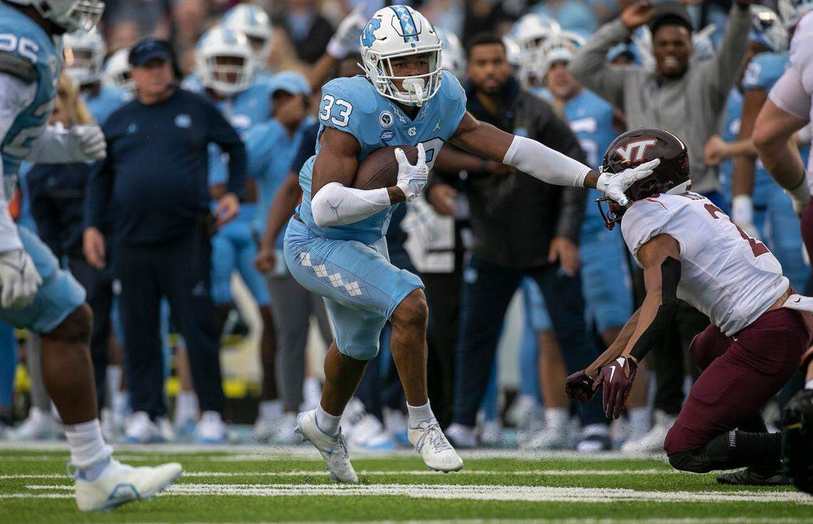 North Carolina linebacker Cedric Gray (33) returns the ball 17-yards after intercepting Virginia Tech quarterback Grant Wells in the second quarter on Saturday, October 1, 2022 at Kenan Stadium in Chapel Hill, N.C.