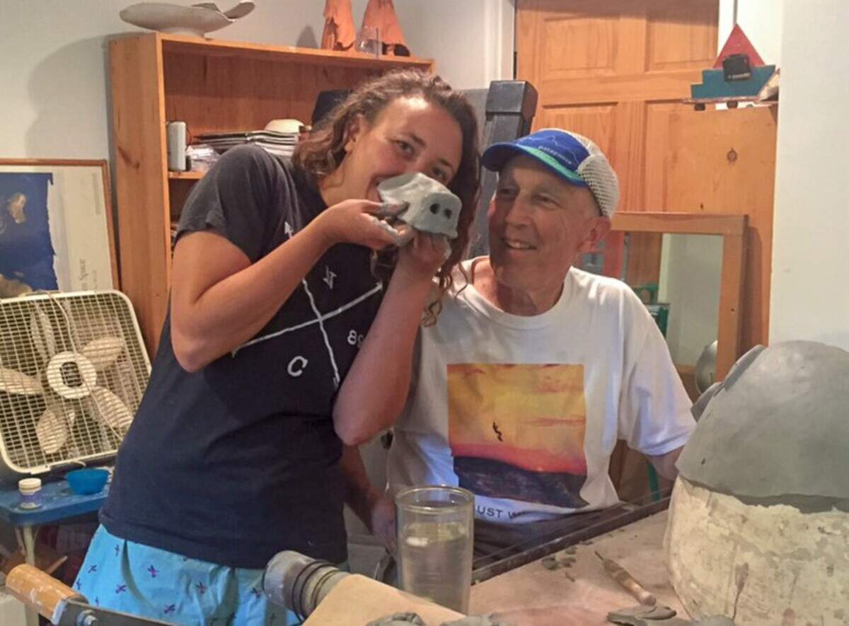 Betsy Bertram and her late father, Scott Bertram in their home pottery studio. Scott Bertram died in July 2017 and left Betsy a hand-carved desk. The desk went missing in a move but was found and returned to her.