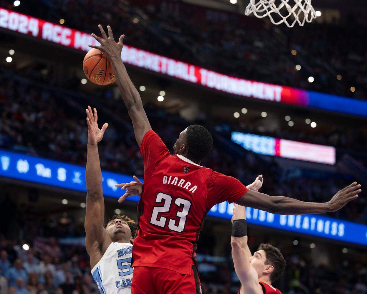 N.C. State’s Mohamed Diarra (23) blocks a shot by North Carolina’s Harrison Ingram (55) in the second half during the ACC Men’s Basketball Tournament Championship at Capitol One Arena on Saturday, March 16, 2024 in Washington, D.C. Diarra had three blocked shots in the Wolfpack victory.