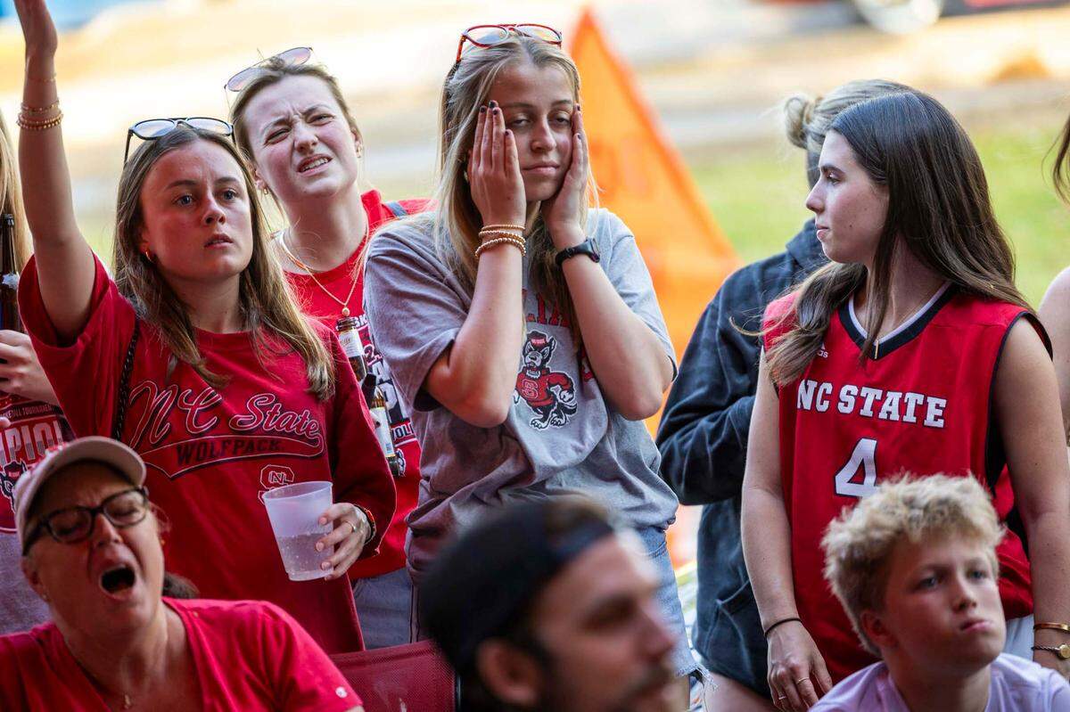 NC state fans at Players’ Retreat in Raleigh react as Duke takes an early lead against the Wolfpack lduring the first half of the Elite Eight round of the NCAA Men’s Division I Basketball Tournament on Sunday, March 31, 2024.