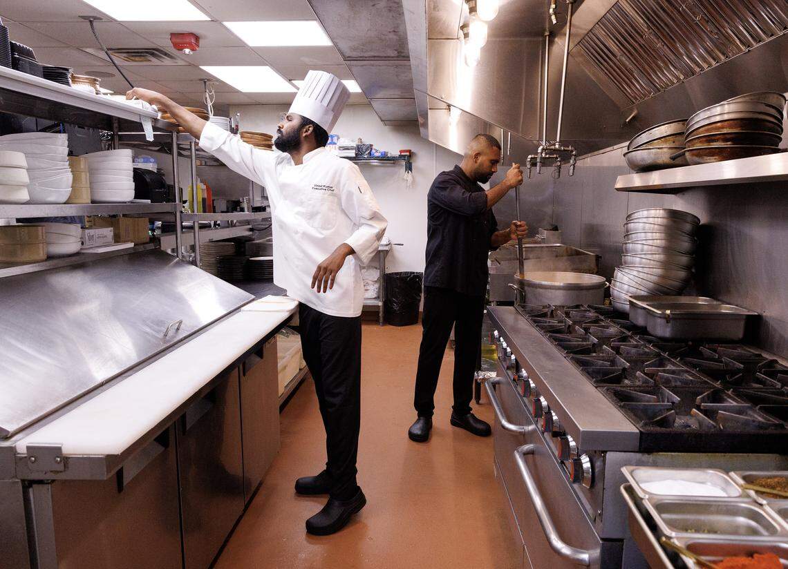 Executive Chef Vinod Kumar and Gowtham Kalimuthu work in the kitchen at Barsa on Thursday, Sept. 25, 2025, in Durham, N.C.