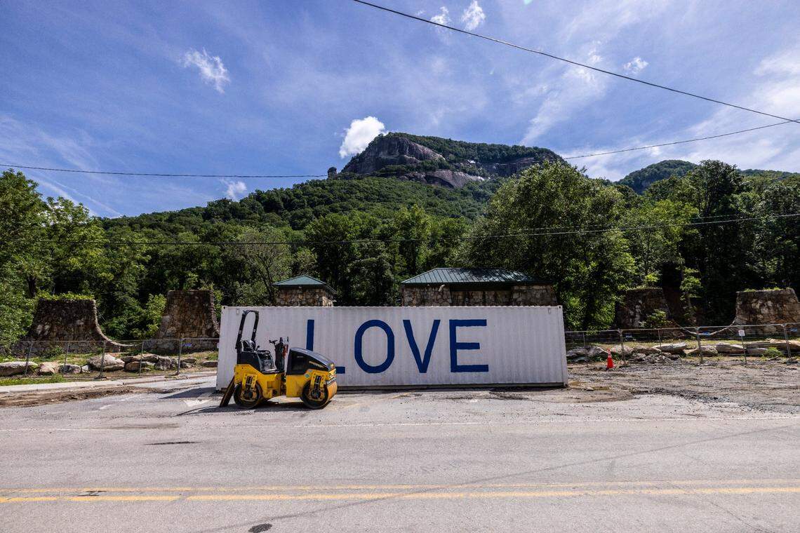A shipping container sits in front of the former entrance to Chimney Rock State Park, where a bridge spanning the Broad River was destroyed by Hurricane Helene. A temporary road now connects Bat Cave and Chimney Rock after the storm wiped out a 2.5-mile stretch of U.S. 64/74A through Hickory Nut Gorge—one of the most severely damaged and costly road repairs in the state.