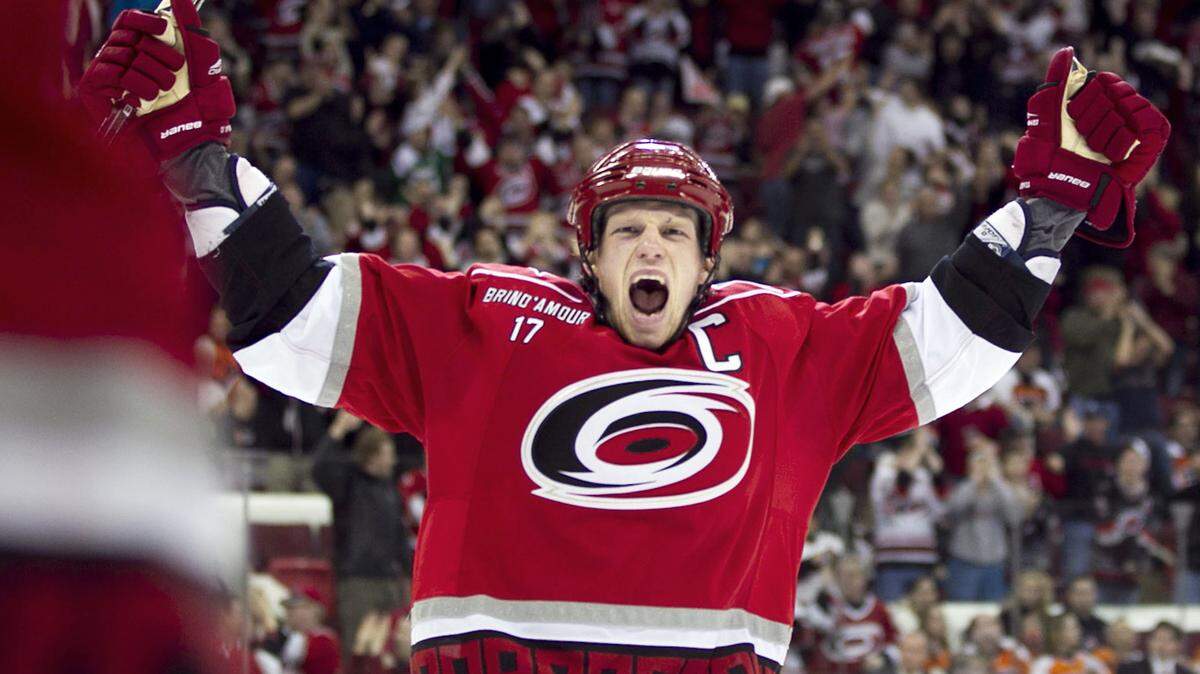 Hurricanes captain Eric Staal (12) celebrates after teammate Erik Cole’s winning goal in the third period. Robert Willett - rwillett@newsobserver.com