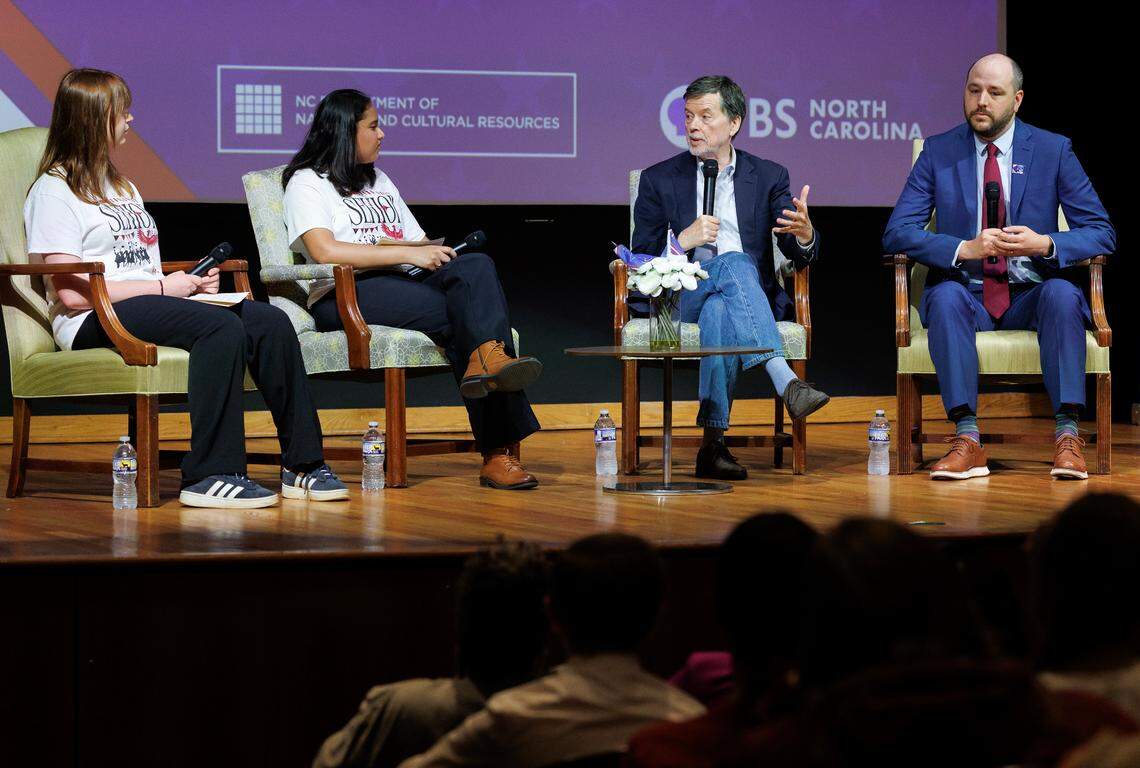 Abby Mocharnuk and Nishitha Daniels, Early College at Guilford seniors, interview Ken Burns and David Schmidt during a panel discussion at the N.C. Department of Natural and Cultural Resources on Thursday, May 15, 2025, in Raleigh, N.C.