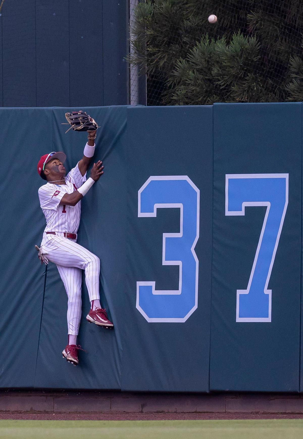 Oklahoma outfielder Jason Walk (1) tries to field a home run ball by North Carolina third baseman Gavin Gallaher (5) in the fourth inning during Game 6 of the NCAA Chapel Hill Regional on Sunday, June 1, 2025 at Boshamer Stadium in Chapel Hill, N.C.