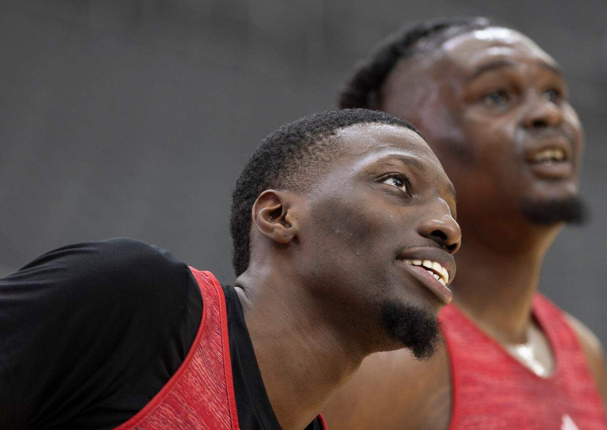 N.C. State’s Mohamed Diarra (23) and D.J. Burns Jr. (30) keep their eyes on the ball during their open practice on Friday, April 5, 2024, as they prepare for their NCAA National Semi-Final game against Purdue at State Farm Stadium in Glendale, AZ.