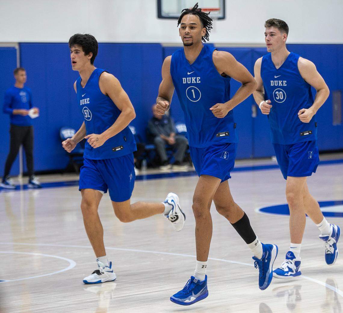 Duke freshmen Dereck Lively II (1) and Kyle Filipowski (30) work out together at the Blue Devils’ second practice of the season on Tuesday, September 27, 2022 in Durham, N.C.