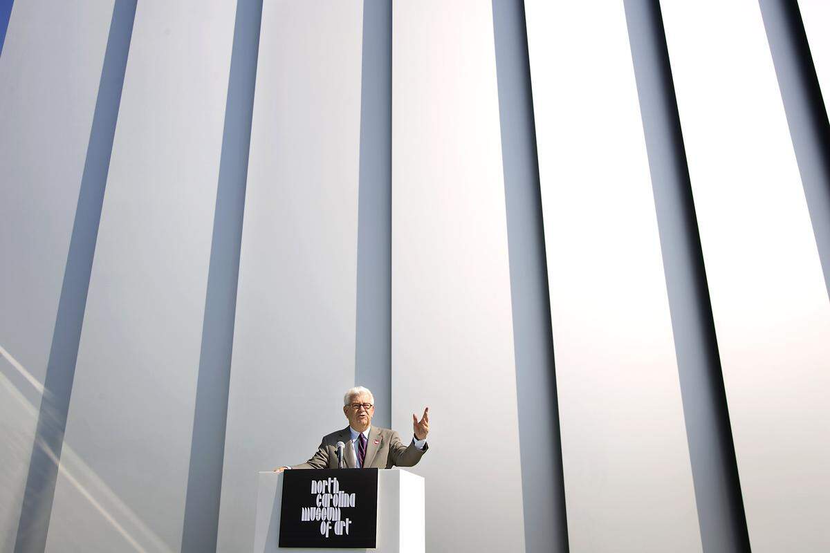 Standing beside the new West Building at the North Carolina Museum of Art in Raleigh, Larry Wheeler, director, addresses members of the media on a preview day on Tuesday, April 6, 2010.