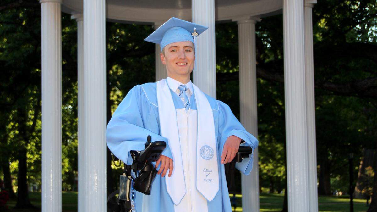 Joe Brown’s graduation photo from 2016 in front of the Old Well.