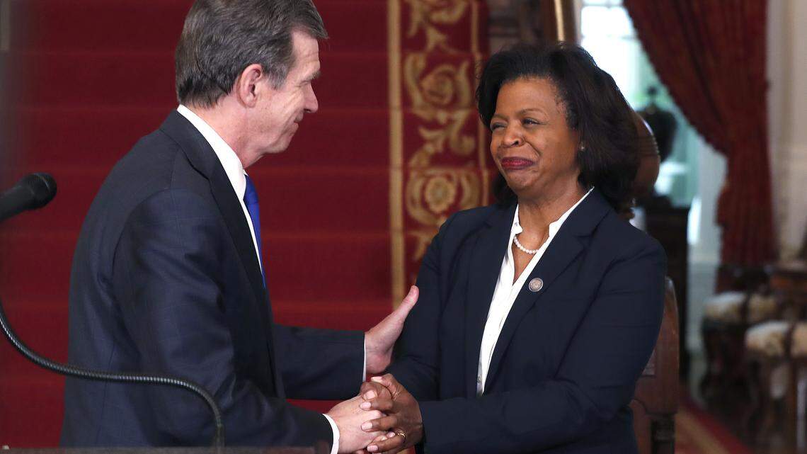 North Carolina Gov. Roy Cooper, left, congratulates Cheri Beasley after naming her as the next Chief Justice of the NC Supreme Court during a press conference at the Executive Mansion in Raleigh, N.C., Tuesday, Feb. 12, 2019.