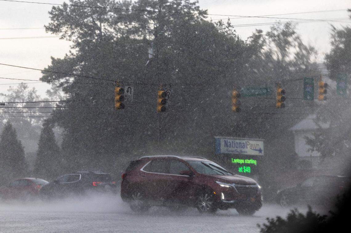 Drivers navigate the intersection of Capital and Westinghouse Boulevards in Raleigh as streetlights were out during a severe thunderstorm that swept through the Triangle on Tuesday afternoon, Aug 15, 2023.