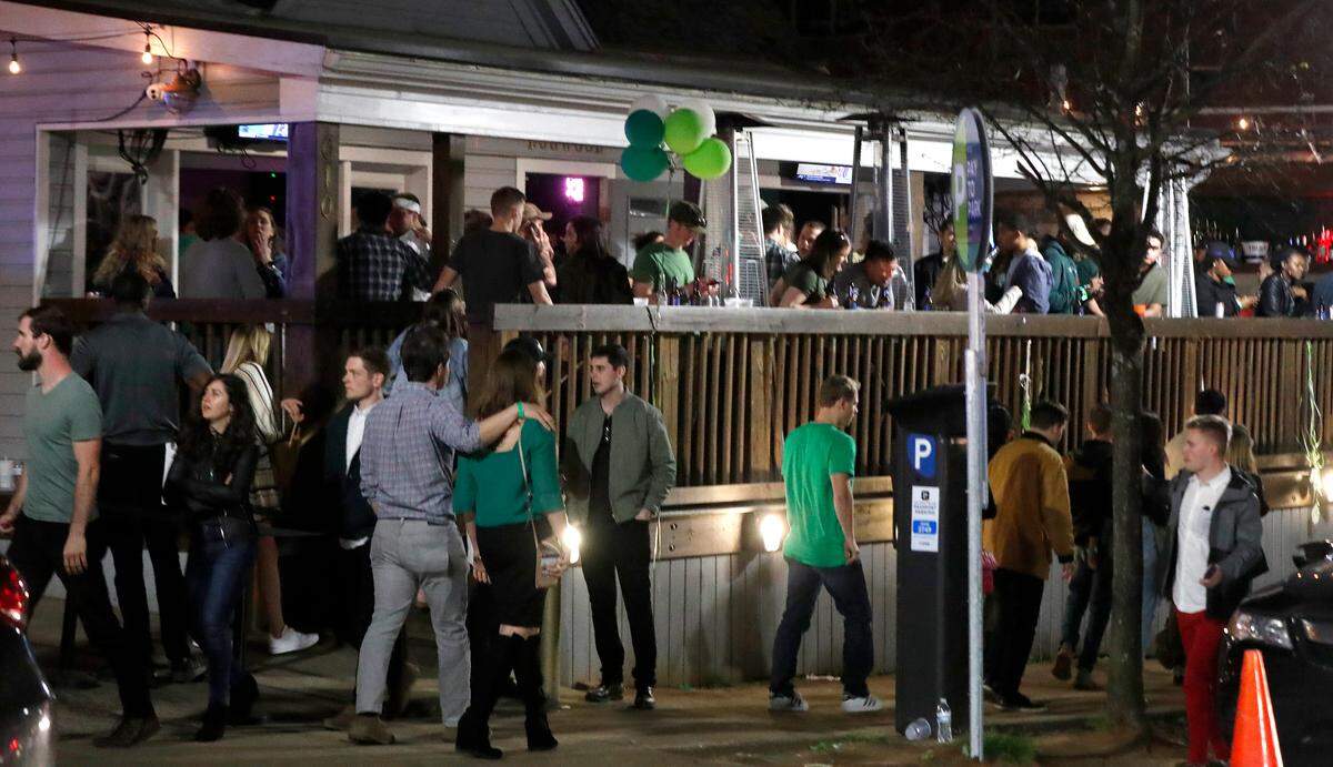 Bars in the Glenwood South district of Raleigh were busy Saturday night. Bars and restaurants are exempt from Gov. Roy Cooper’s ban on gatherings of more than 100 people to try to stem the spread of coronavirus.