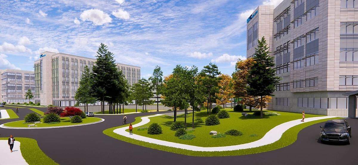 A preliminary rendering of the UNC Health Eastown campus, as seen from the existing parking deck, shows how the next medical building (at right) and future buildings would be connected and look in relation to their environment.