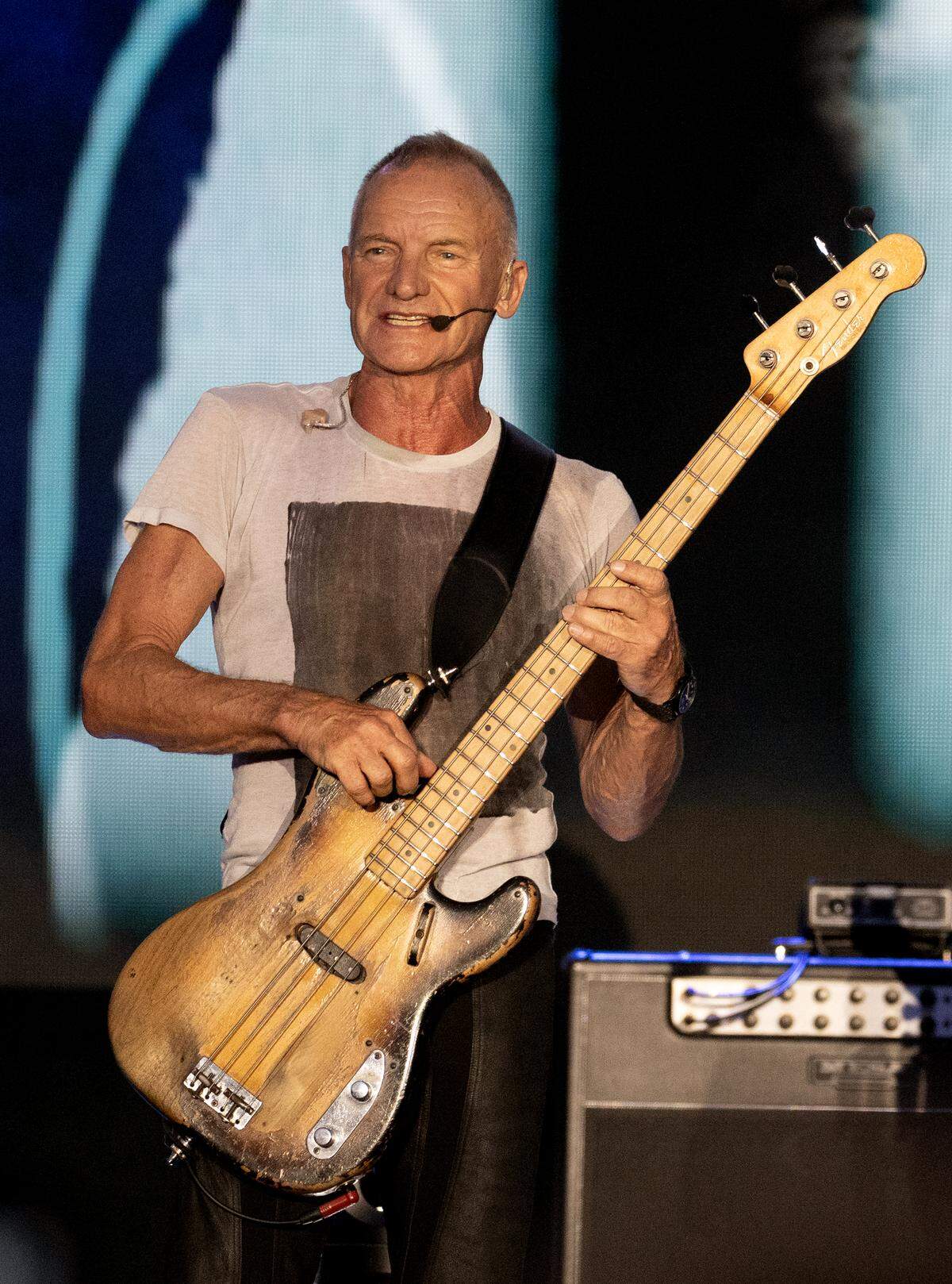 Sting plays high on the neck of his well-worn bass guitar in Raleigh.