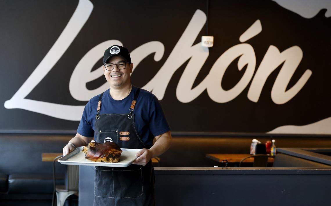 Jorge Thorne, owner of Lechon Latin BBQ in Raleigh, N.C., poses with shoulder of Lechon con cuero (roasted pork with crisp skin) Wednesday, August 27, 2025.