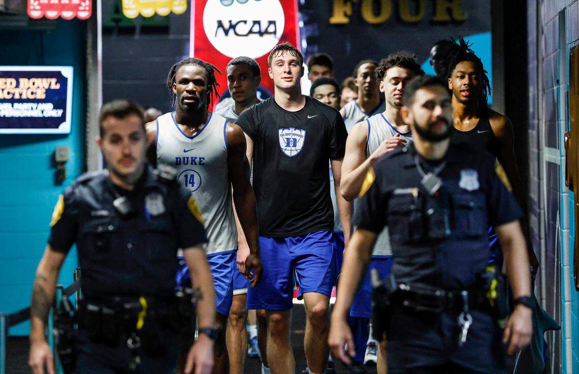 The Duke team, including Cooper Flagg, center, head back to the locker room after their practice at the Alamodome in San Antonio, Texas, Thursday, April 3, 2025. Duke faces Houston in the national semifinal Saturday.