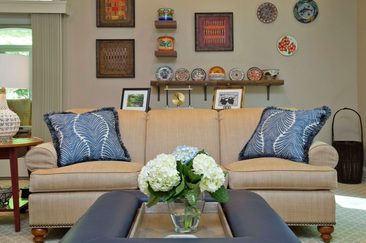 It's fun to create a vibrant art wall with family antiques and a variety of objects collected on travels.