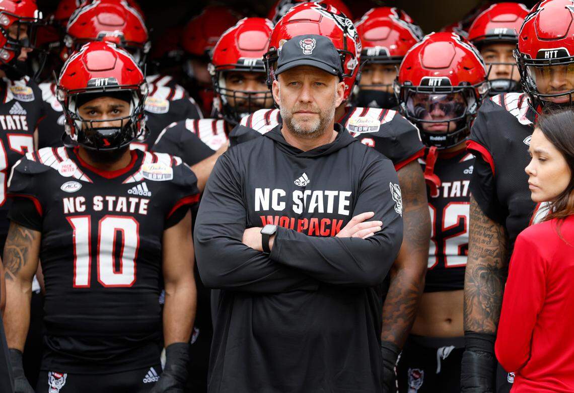 N.C. State head coach Dave Doeren prepares to lead his team out onto the field before N.C. State’s game against Maryland in the Duke’s Mayo Bowl at Bank of America Stadium in Charlotte, N.C., Friday, Dec. 30, 2022.