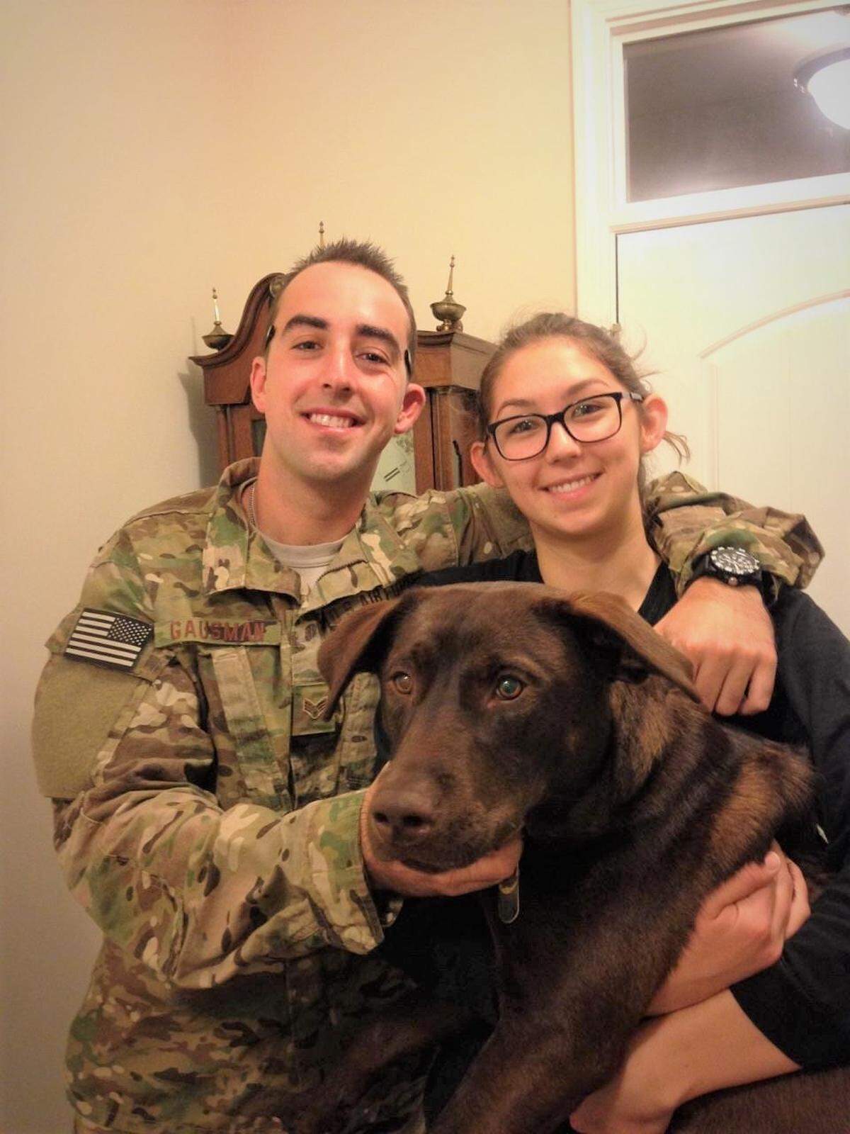 Robby and Brianna Gausman adopted Ajax, a chocolate lab mix, in South Carolina before moving to Durham.