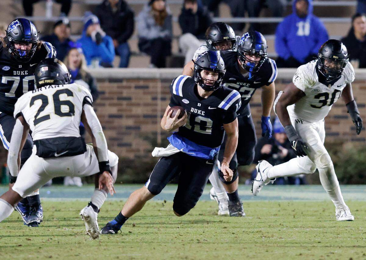 Duke’s Grayson Loftis runs the ball during the second half of the Blue Devils’ 24-21 win over Wake Forest on Thursday, Nov. 2, 2023, at Wallace Wade Stadium in Durham, N.C.