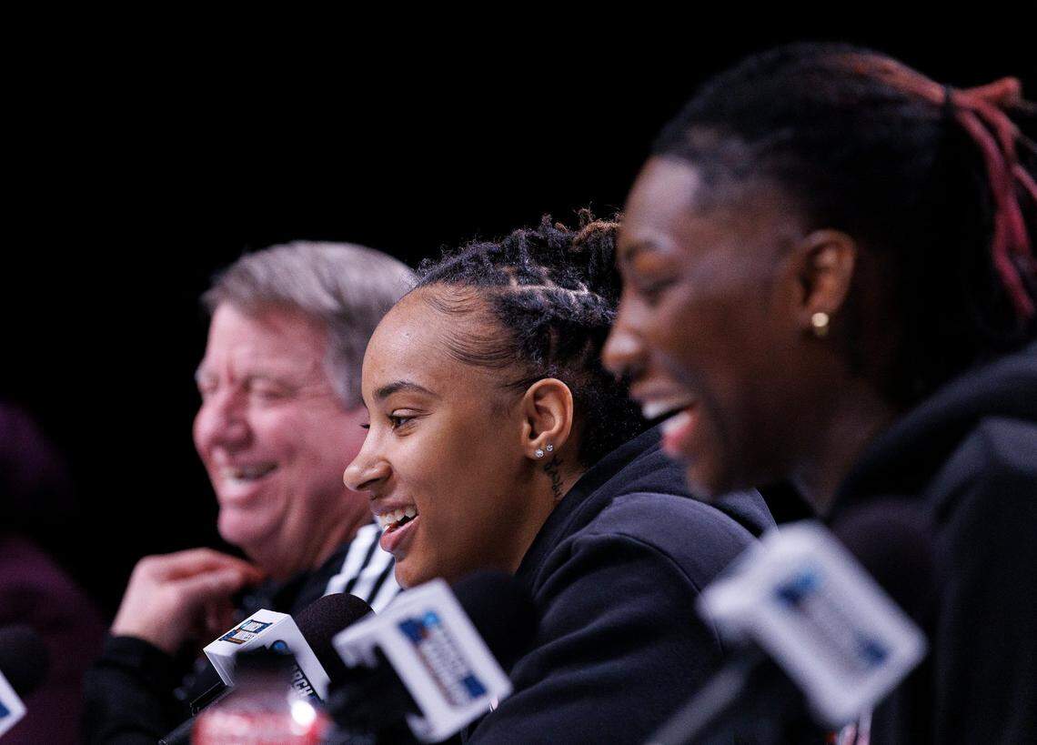 N.C. State’s Aziaha James and Saniya Rivers smile while answering a question about head coach Wes Moore’s singing abilities during a press conference at Rocket Mortgage FieldHouse on Thursday, April 4, 2024, in Cleveland, Ohio. The Wolfpack will face South Carolina in the Final Four on Friday.