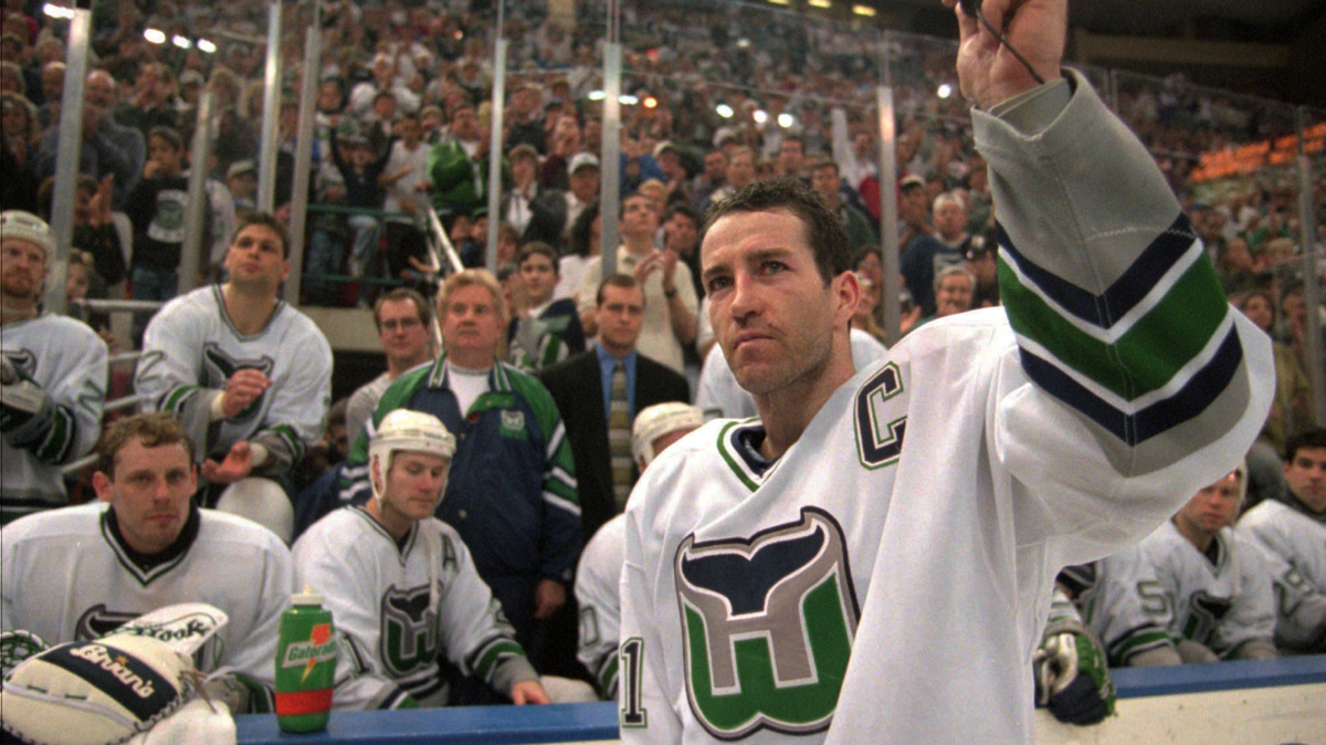 Hartford Whalers captain Kevin Dineen waves to the fans Sunday, April 13, 1997, after he briefly addressed them at the end of the Whalers final game in Hartford, Conn. The Whalers defeated the Tampa Bay Lightning 2-1 to end their season and their stay in Hartford. (AP Photo/Richard Mei)