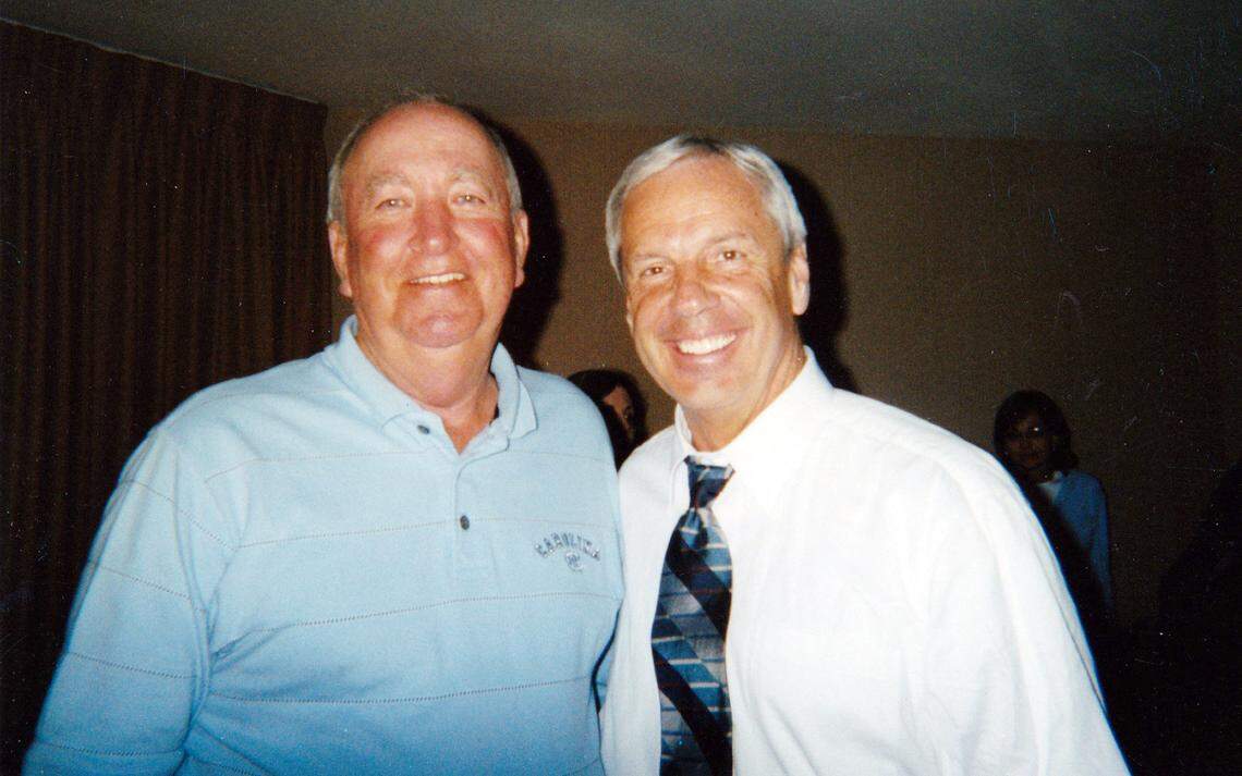 Roy Williams with his high school coach Buddy Baldwin, left, after the 2005 championship game.