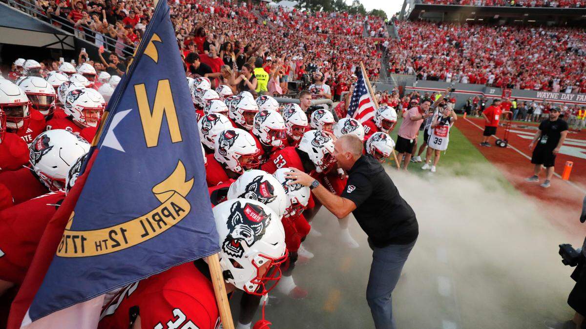 N.C. State head coach Dave Doeren prepares to lead his team out onto the field before the Wolfpack’s game against Western Carolina at Carter-Finley Stadium in Raleigh, N.C., Thursday, August 29, 2024.