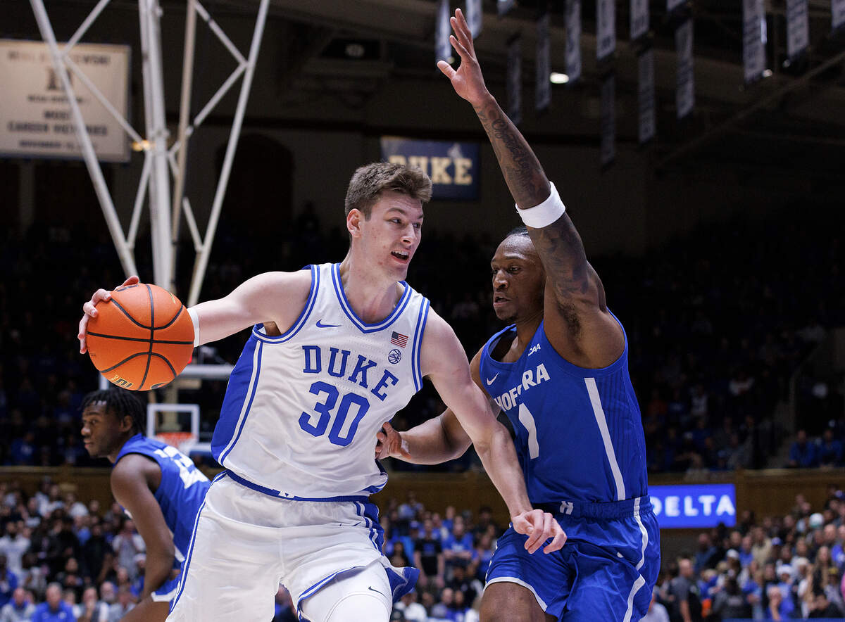 Duke’s Kyle Filipowski drives past Hofstra’s Darlinstone Dubar during the first half of the Blue Devils’ 89-68 win on Tuesday, Dec. 12, 2023, at Cameron Indoor Stadium in Durham, N.C.