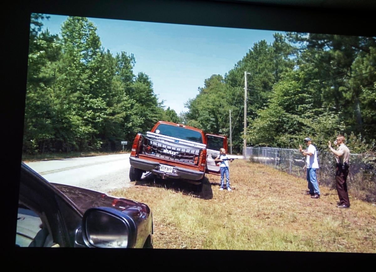 A difficult scenario involving a child with a gun is projected on the wall with the new, portable FATS 100P Meggitt Training Simulator which will help train local law enforcement agencies across the state on active shooter situations, focusing on verbal de-escalation skills, on Monday, Sept. 9, 2019, at Wake Technical Community College in Raleigh, NC.