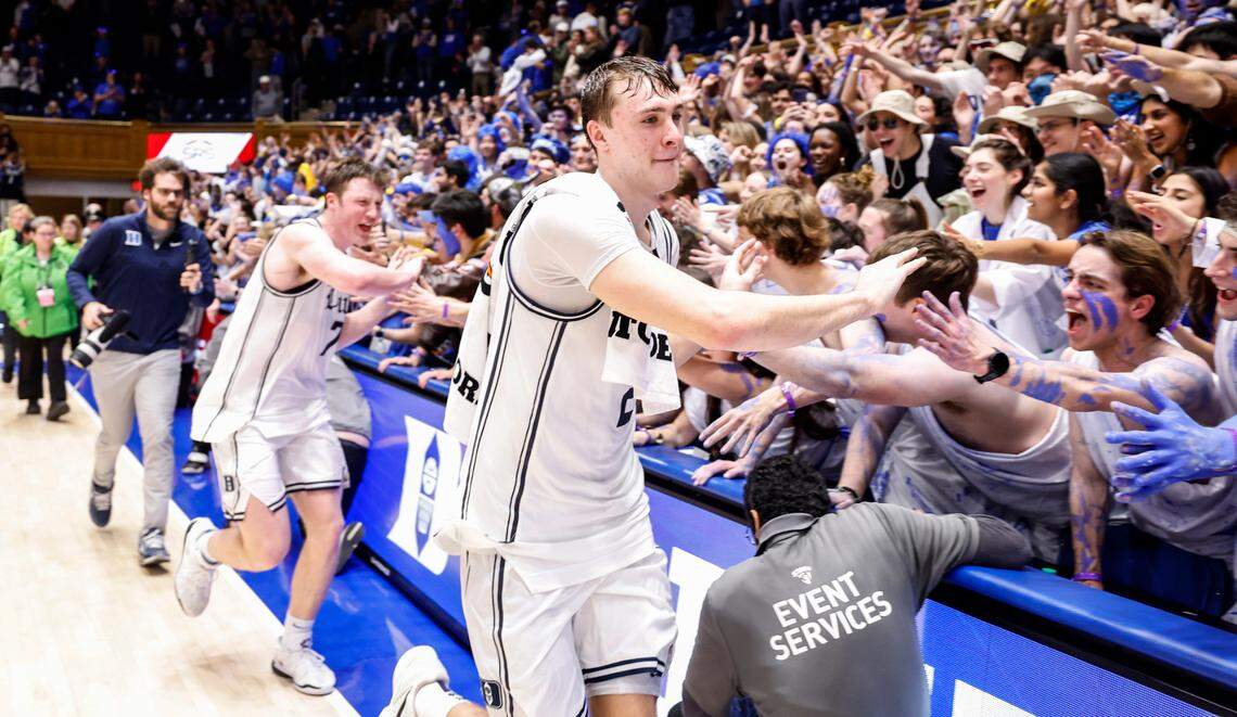 Duke’s Cooper Flagg (2) and Kon Knueppel (7) celebrate with the Cameron Crazies after Duke’s 87-70 victory over UNC at Cameron Indoor Stadium in Durham, N.C., Saturday, Feb. 1, 2025.