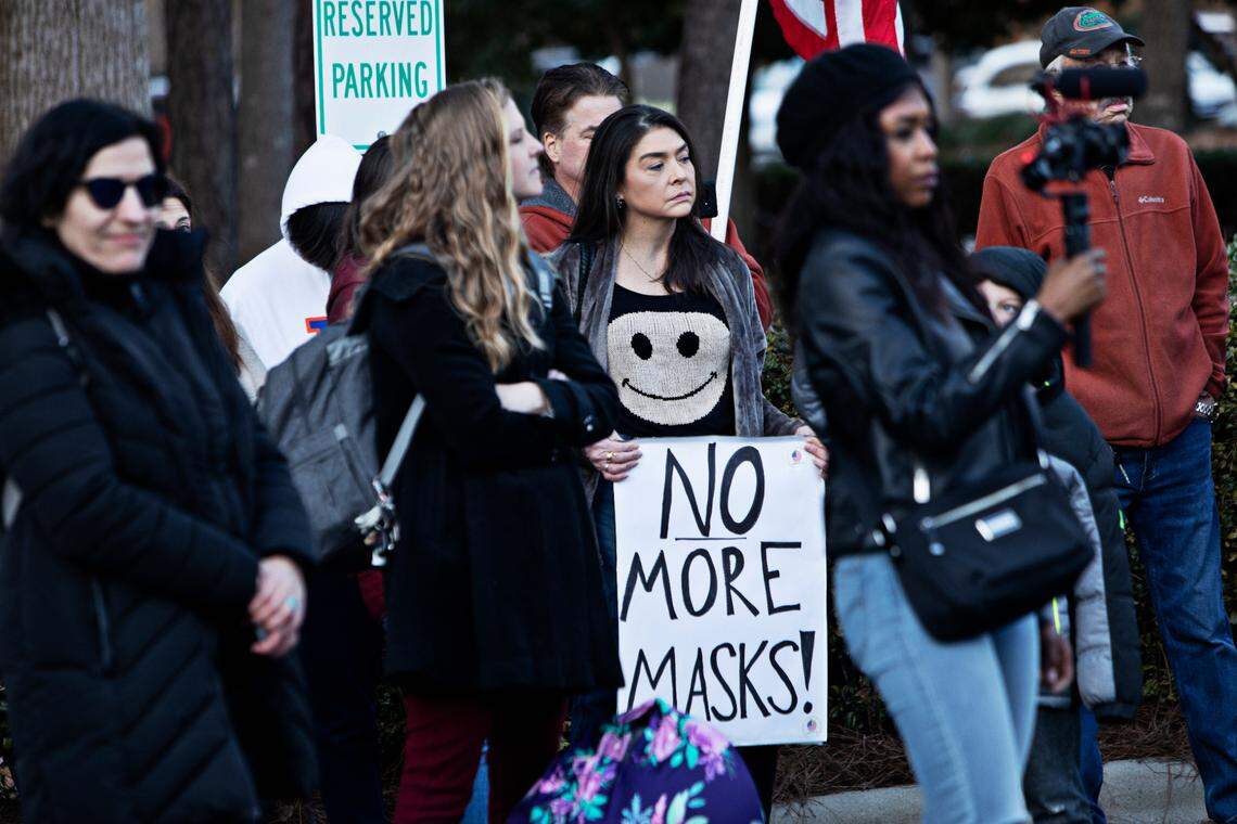 A crowd of around 100 people rallied outside Tuesday’s Wake County school board meeting in Cary Feb. 15, 2022, demanding that the district immediately stop mandating that students wear masks. Event participants want the school board to vote Tuesday or to call a special meeting by next week to vote on making masks optional.