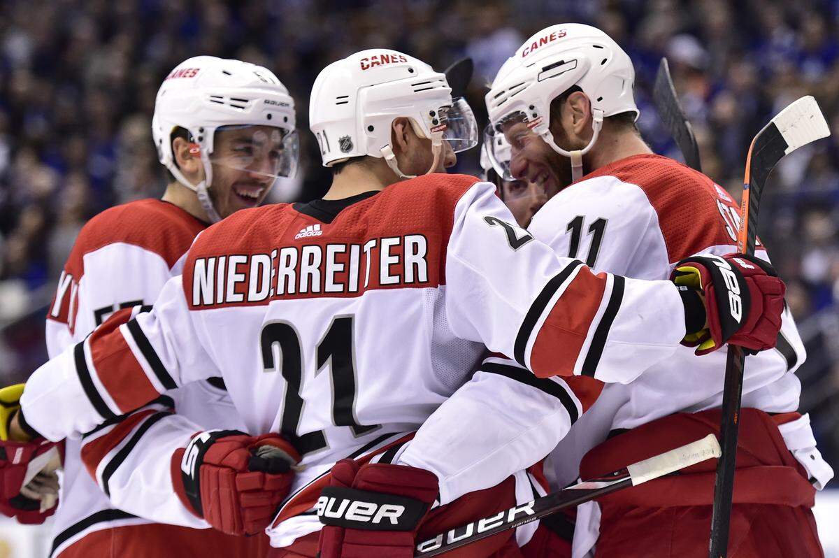 Jordan Staal, right, celebrates with Nino Niederreiter, center, and Trevor van Reimsdyk after scoring one of the Carolina Hurricanes’ goals in a 4-1 win at the Toronto Maple Leafs on Tuesday. “It’s been fun being involved with these kinds of games,” Staal said.