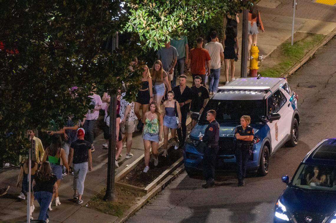 Raleigh Police officers maintain a presence at around 1 a.m. in the Glenwood South district on Friday, July 21, 2023.