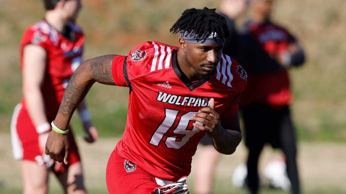 N.C. State wide receiver Darryl Jones (19) does some warmup drills during the first day of the Wolfpack’s spring football practice in Raleigh, N.C., Wednesday, March 2, 2022.