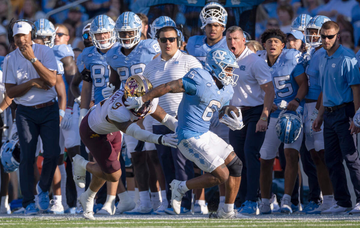 Minnesota’s Devon Williams (9) works to get North Carolina’s Nate McCollum (6) out of bounds after an 11-yard pass reception from quarterback Drake Maye in the third quarter on Saturday, September 16, 2023 at Kenan Stadium in Chapel Hill N.C.